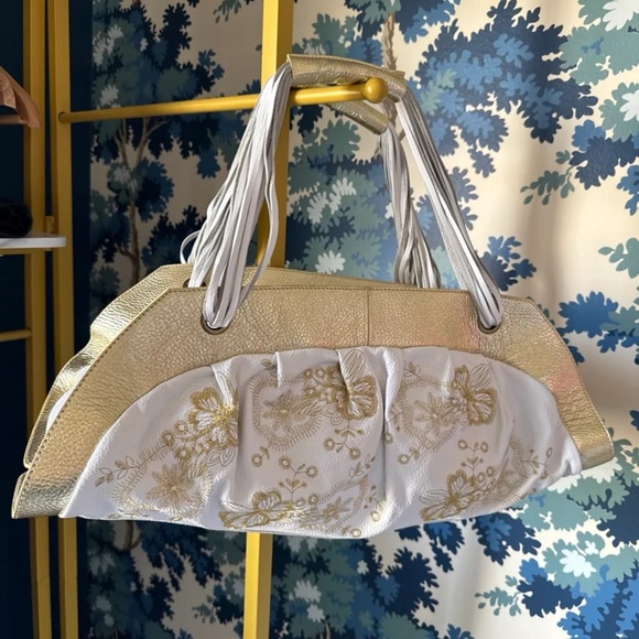 Flora Bella Handbags - NWT Flora Bella White with Gold Floral Embroidered Oblong Leather Purse